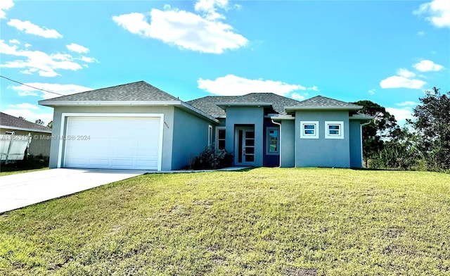 view of front facade with a garage and a front yard