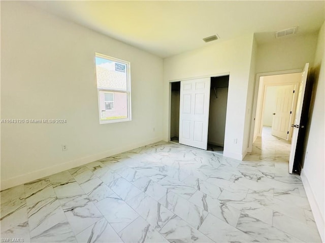 unfurnished bedroom with a closet