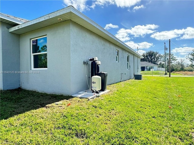 view of side of home featuring a yard