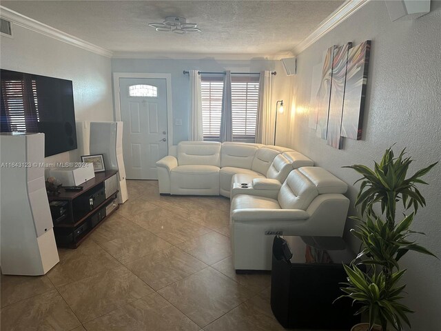 tiled living room featuring a textured ceiling and crown molding