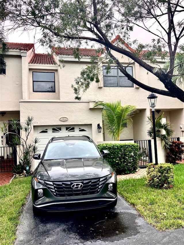 view of front of property with a garage