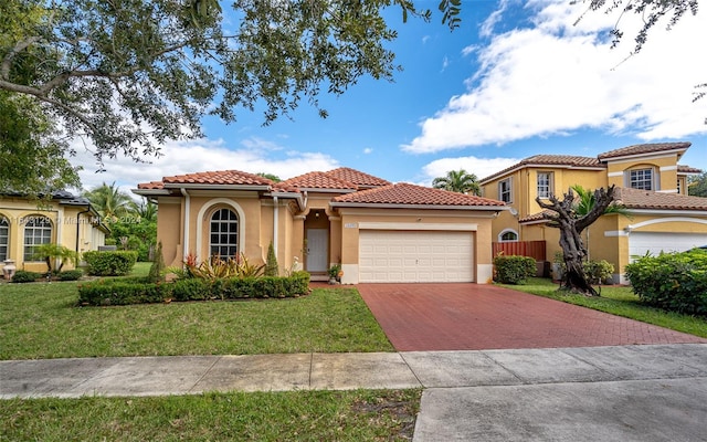 mediterranean / spanish-style home with a front yard