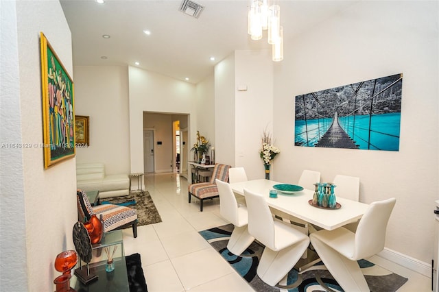 dining room with high vaulted ceiling and light tile patterned floors