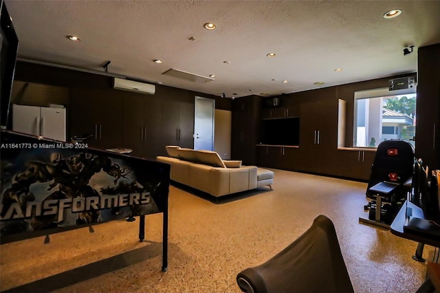 living room with recessed lighting, a wall mounted air conditioner, and a textured ceiling