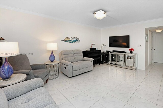 living room featuring light tile patterned floors and crown molding