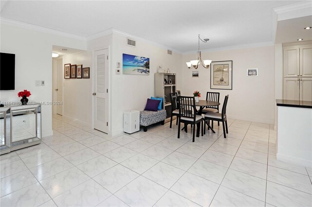 tiled dining area with a notable chandelier and ornamental molding