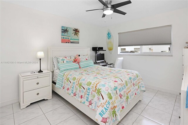 bedroom featuring ceiling fan and light tile patterned floors