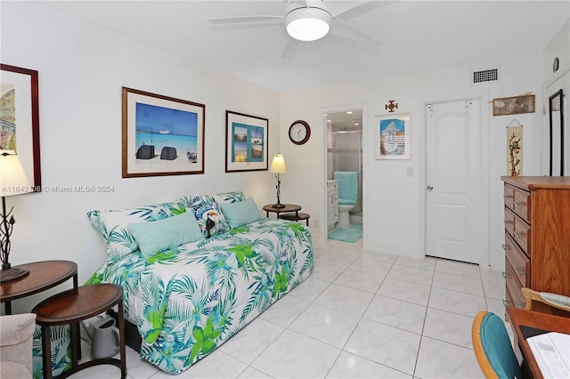 bedroom featuring ensuite bath, ceiling fan, and light tile patterned flooring