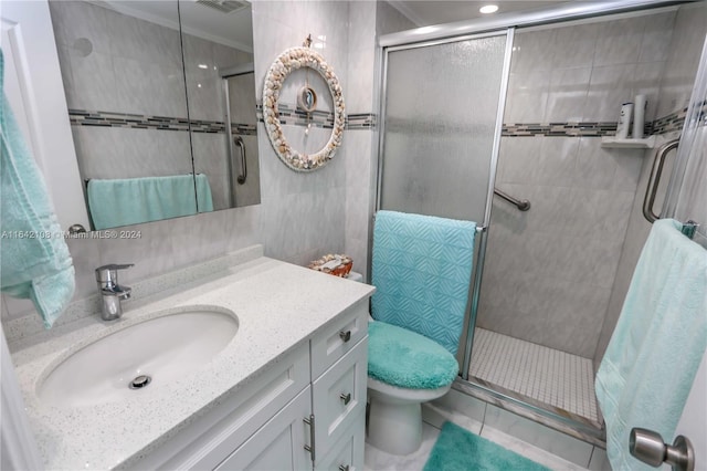 bathroom featuring vanity, tile walls, walk in shower, and toilet