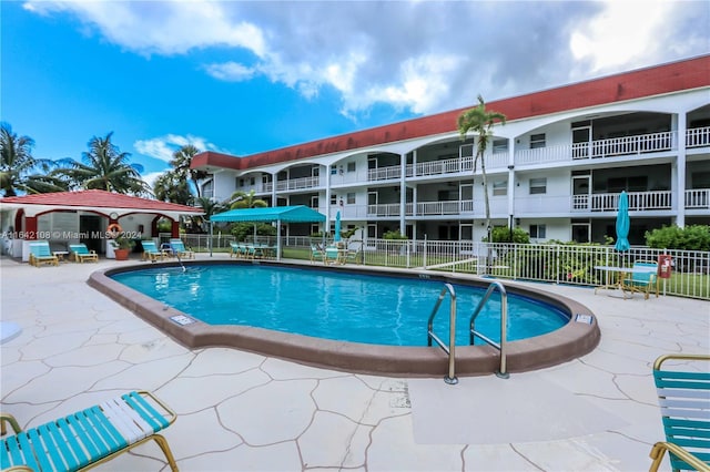 view of swimming pool featuring a patio area