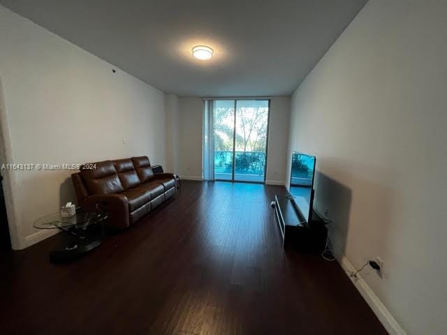 living room featuring hardwood / wood-style flooring and floor to ceiling windows