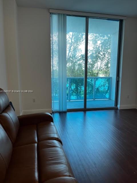 unfurnished living room featuring hardwood / wood-style flooring