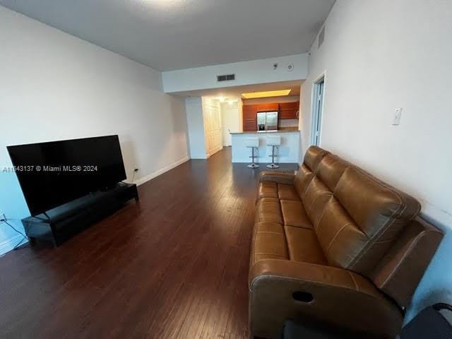 living room with dark wood-type flooring