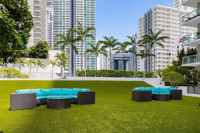 view of home's community with a yard and an outdoor hangout area