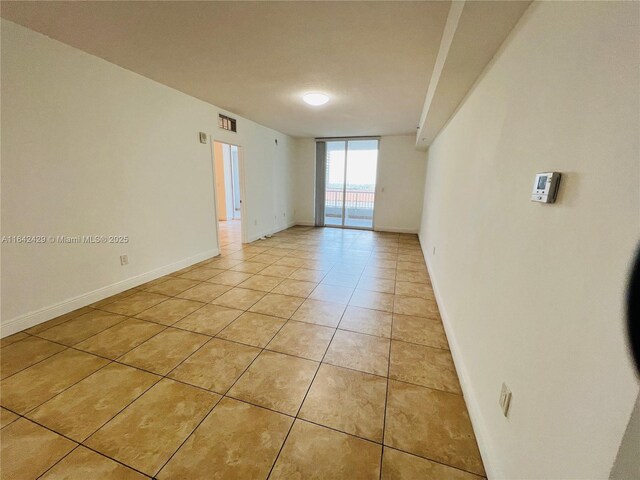 empty room featuring light tile patterned floors