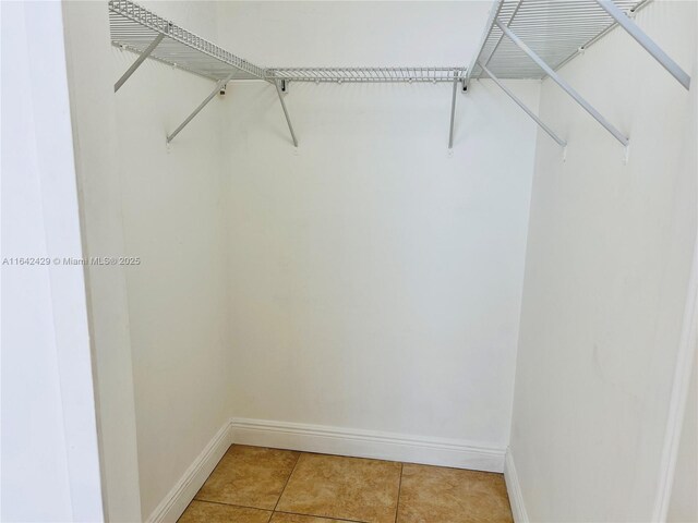 walk in closet featuring tile patterned floors