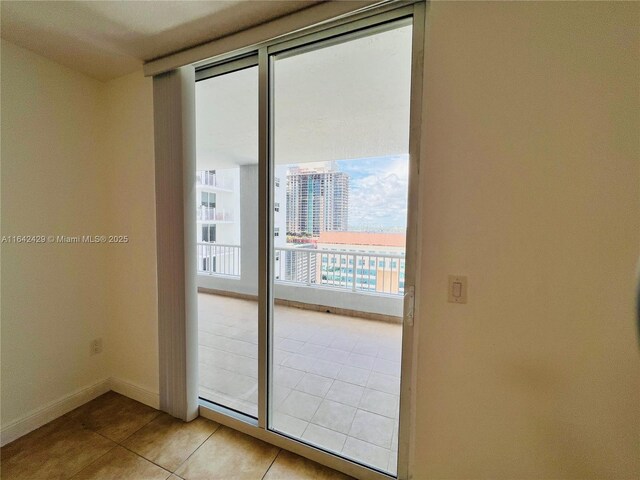 doorway featuring light tile patterned floors