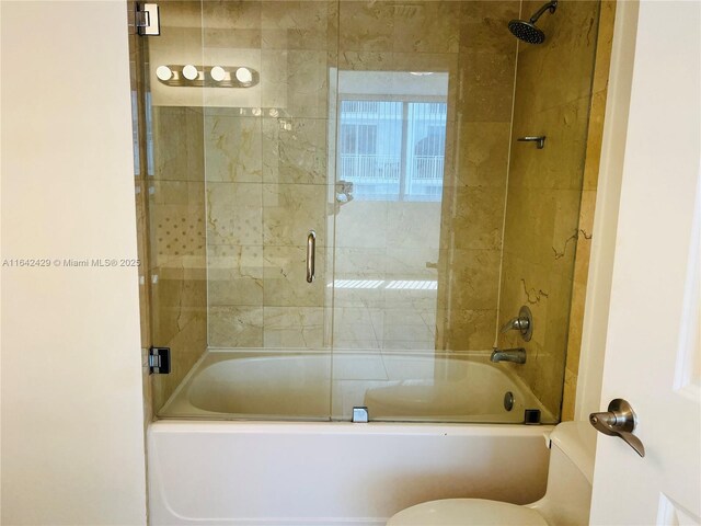 bathroom with enclosed tub / shower combo