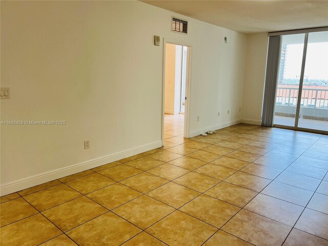 empty room featuring light tile patterned flooring