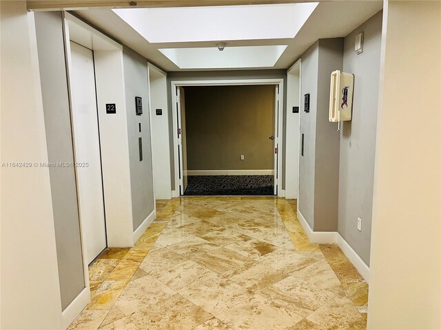 hallway featuring elevator