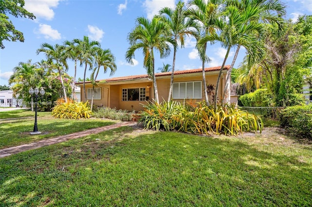 view of front of home with a front lawn