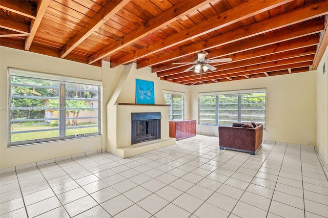 unfurnished living room featuring beamed ceiling, wooden ceiling, and light tile patterned floors