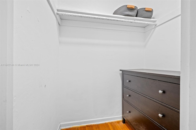 spacious closet featuring light hardwood / wood-style floors