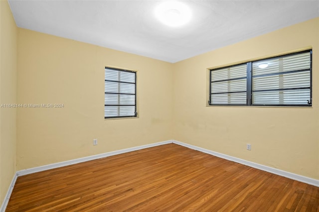 spare room featuring hardwood / wood-style floors