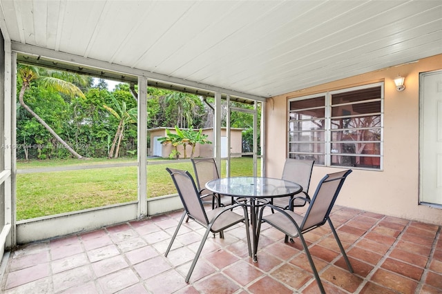 unfurnished sunroom with plenty of natural light