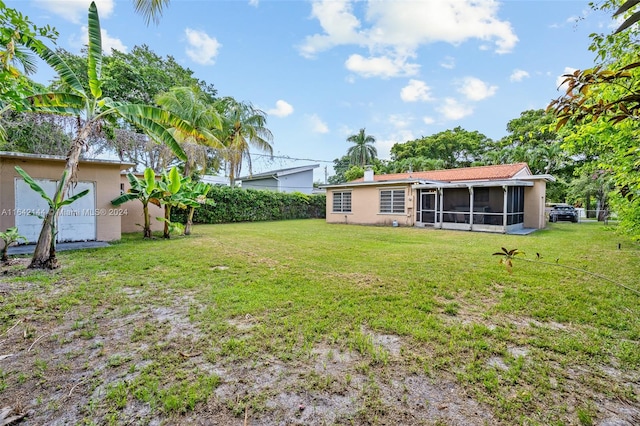 view of yard with a sunroom