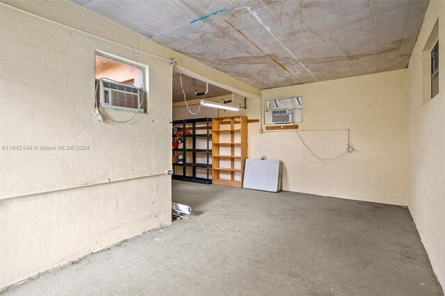 basement with a wall mounted AC and cooling unit