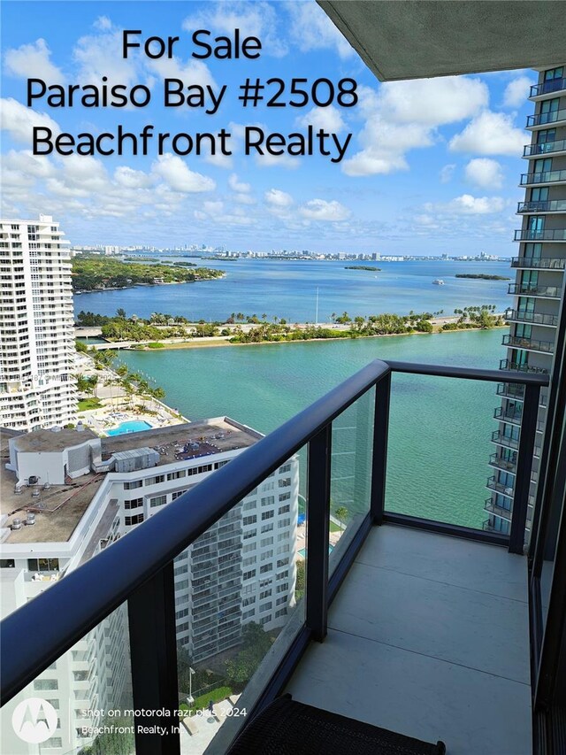 empty room featuring expansive windows and a water view