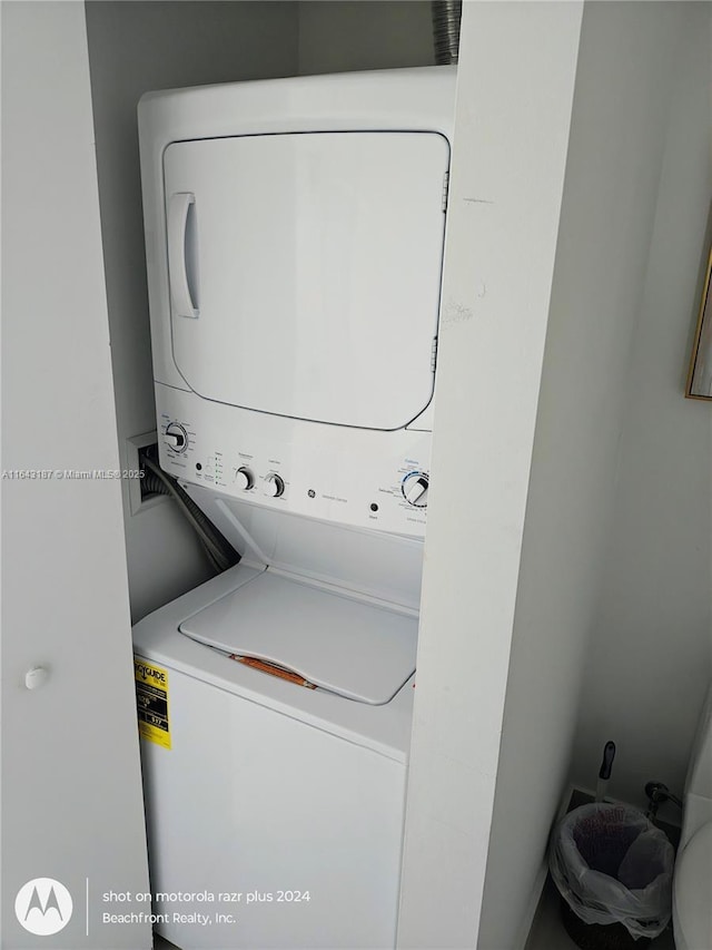 laundry room featuring stacked washer and clothes dryer