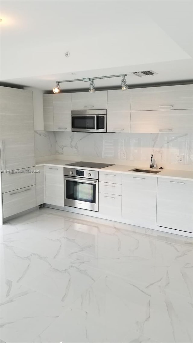 kitchen featuring stainless steel appliances and sink