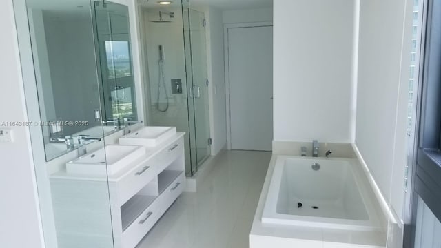 bathroom with vanity and independent shower and bath