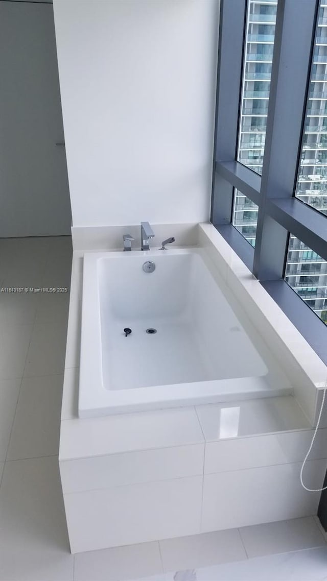 bathroom featuring a relaxing tiled tub