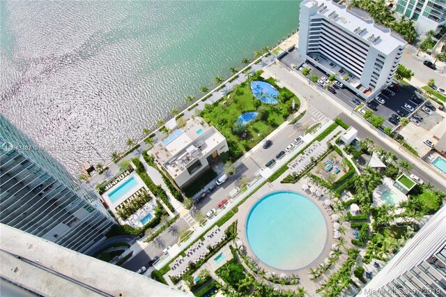 birds eye view of property with a water view