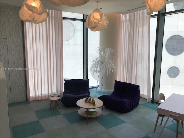 sitting room featuring expansive windows