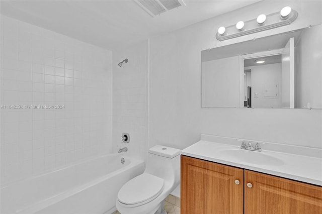 full bathroom featuring tiled shower / bath combo, vanity, and toilet