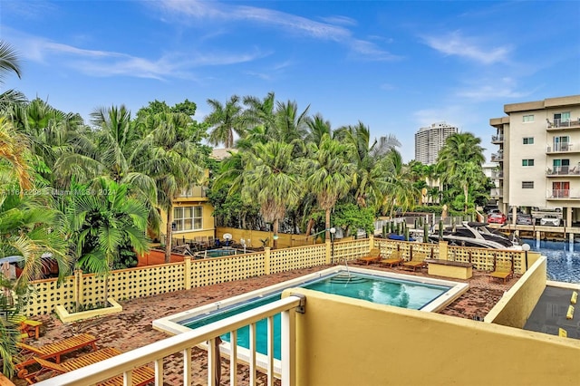 view of swimming pool featuring a water view