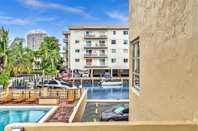 view of swimming pool with a water view