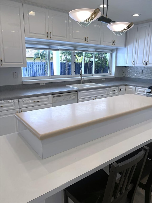 kitchen featuring white cabinets and sink