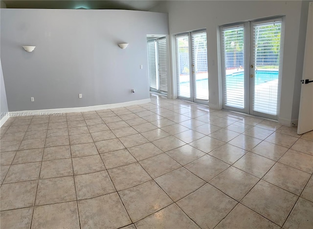 bathroom featuring toilet, a shower with curtain, tile patterned floors, and vanity