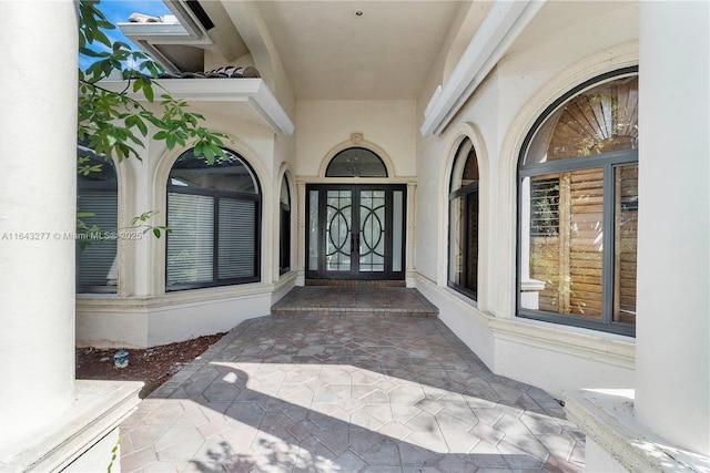 doorway to property with stucco siding