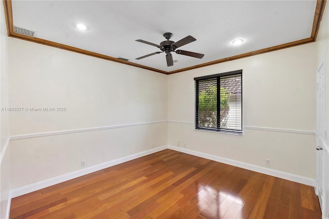 unfurnished room featuring ceiling fan, crown molding, and hardwood / wood-style flooring