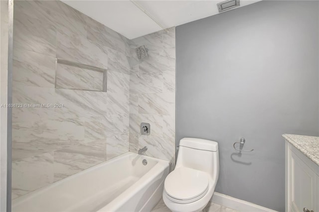 full bathroom featuring toilet, tiled shower / bath combo, and vanity