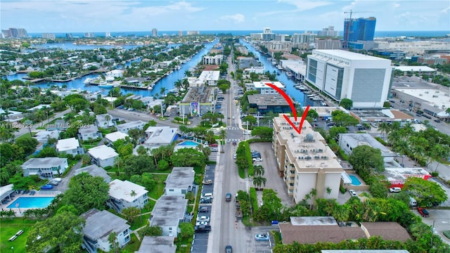 birds eye view of property featuring a water view