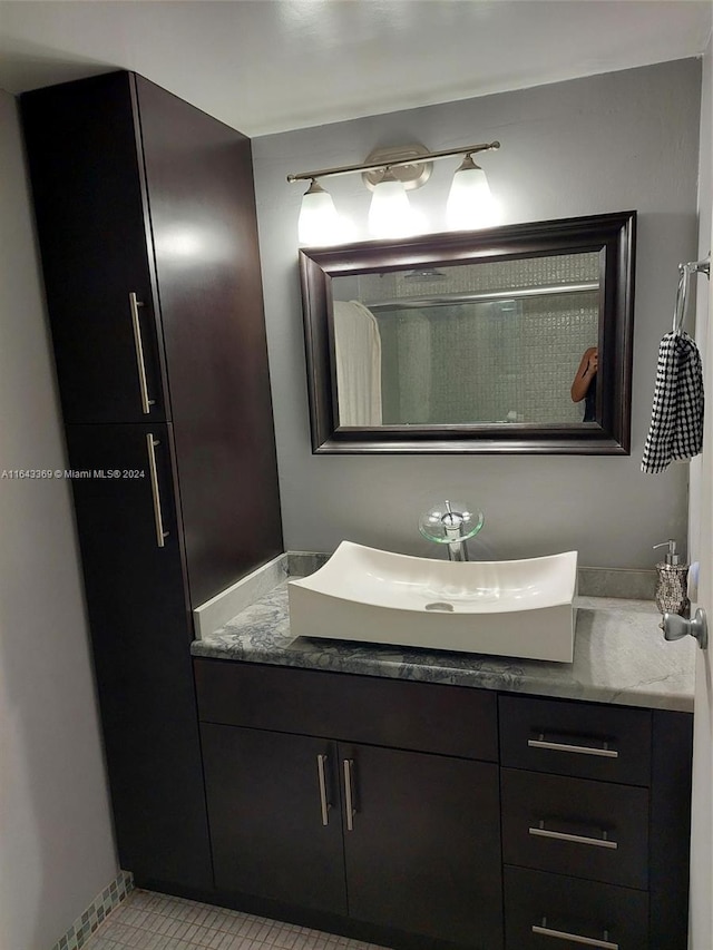 bathroom with vanity and tile patterned floors