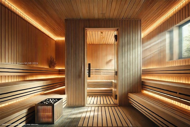 view of sauna featuring wooden walls, hardwood / wood-style floors, and wooden ceiling