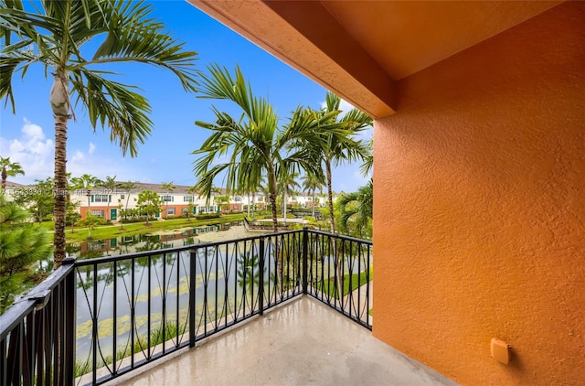 balcony featuring a water view